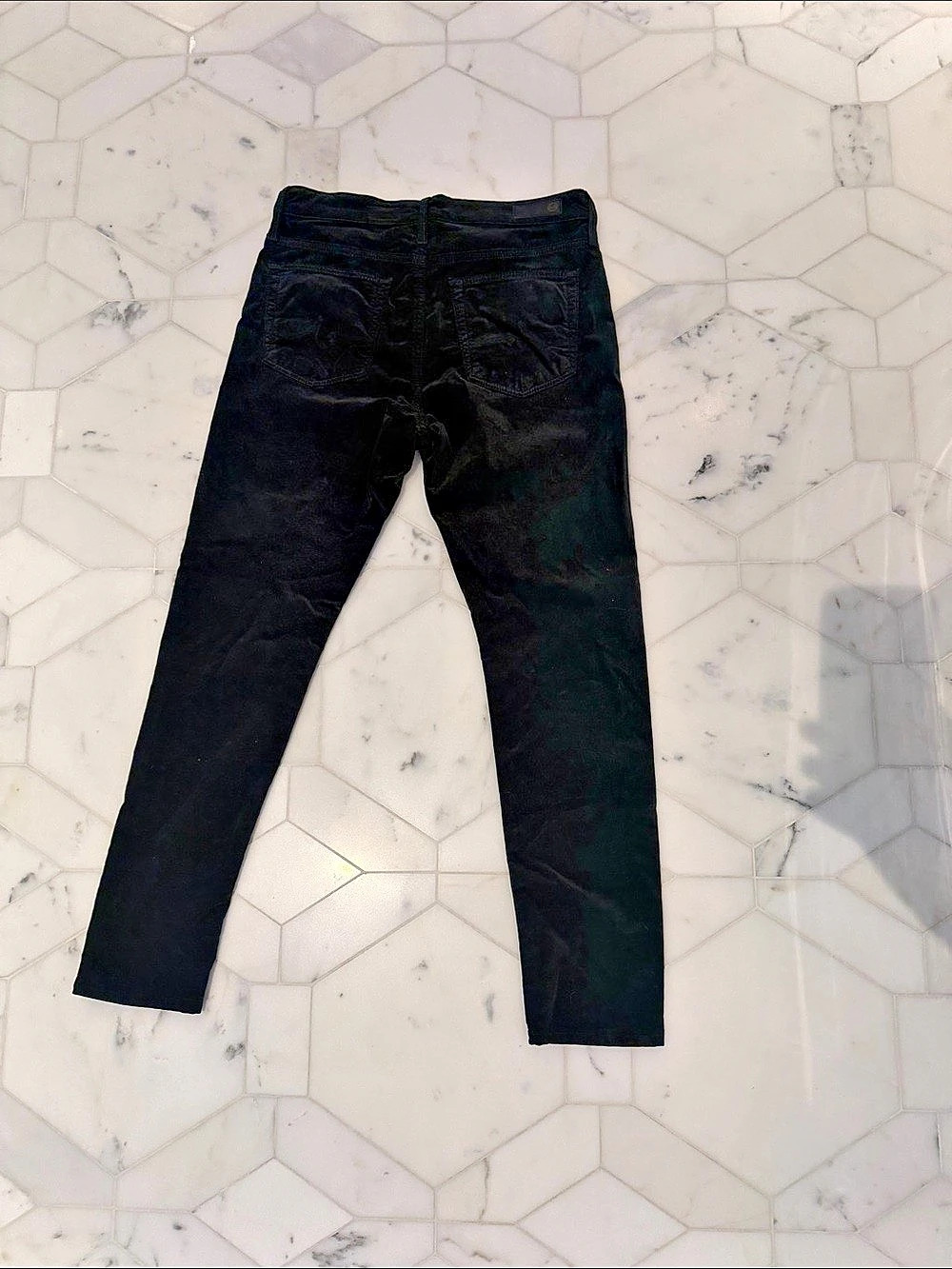 AG Adriano Goldschmied The Farrah Skinny High-Rise Velvet Jean dark green jeans.
